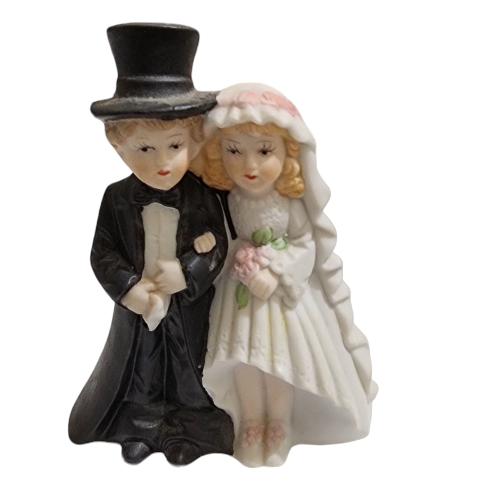 Vintage porcelain 1991 bride and groom wedding topper